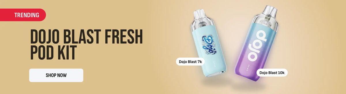 Promotional banner for the Dojo Blast Fresh Pod Kit on a warm beige background, showing two vape pods labeled Dojo Blast 7k and Dojo Blast 50k with a red trending badge and a shopping button.